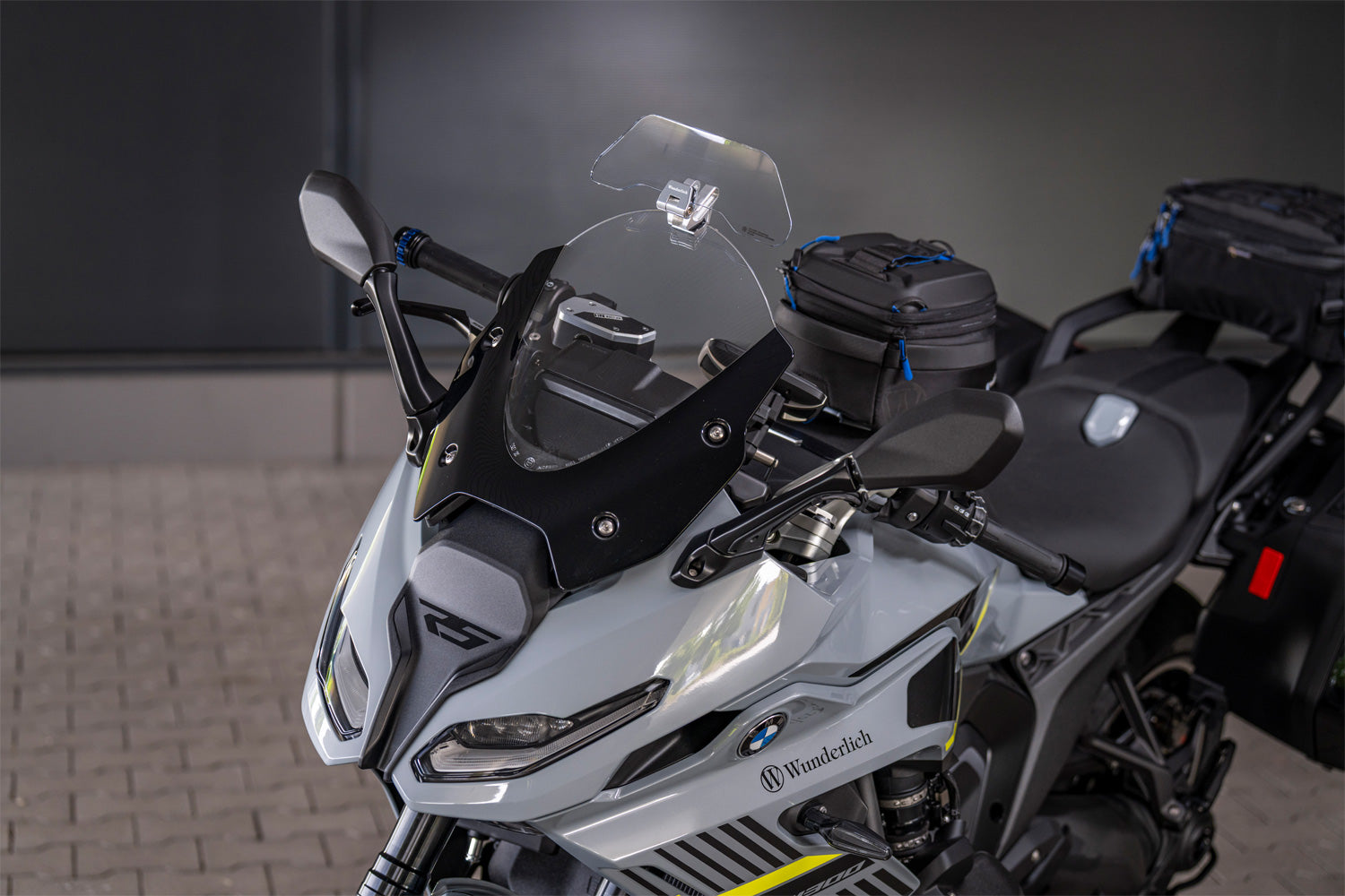 The transparent Wunderlich windshield extension for motorcycle and motorcycles, windshield extension protects against wind, airstream
