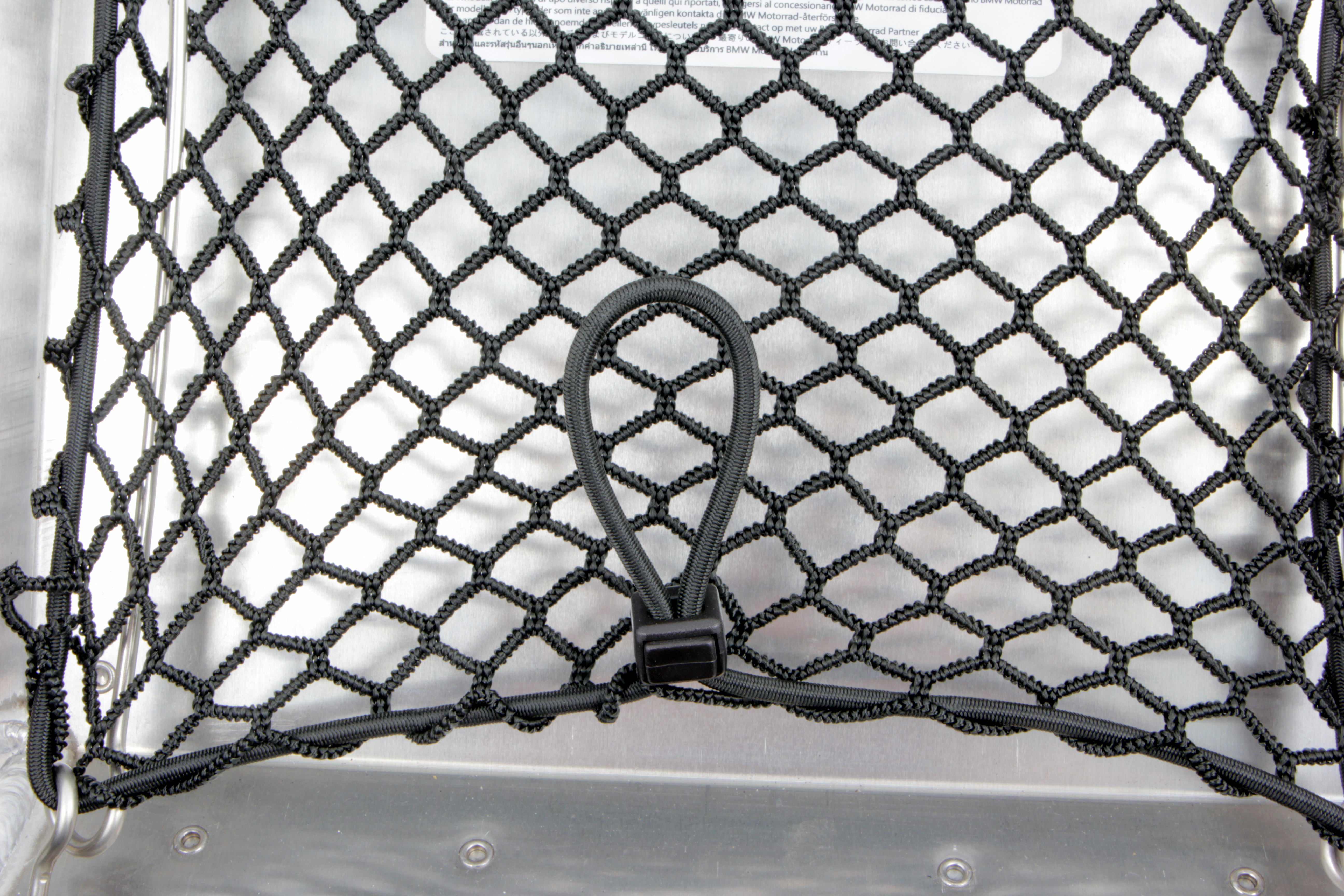 You can store additional luggage in the cover of the original aluminium topcase and have it ready to hand right after opening