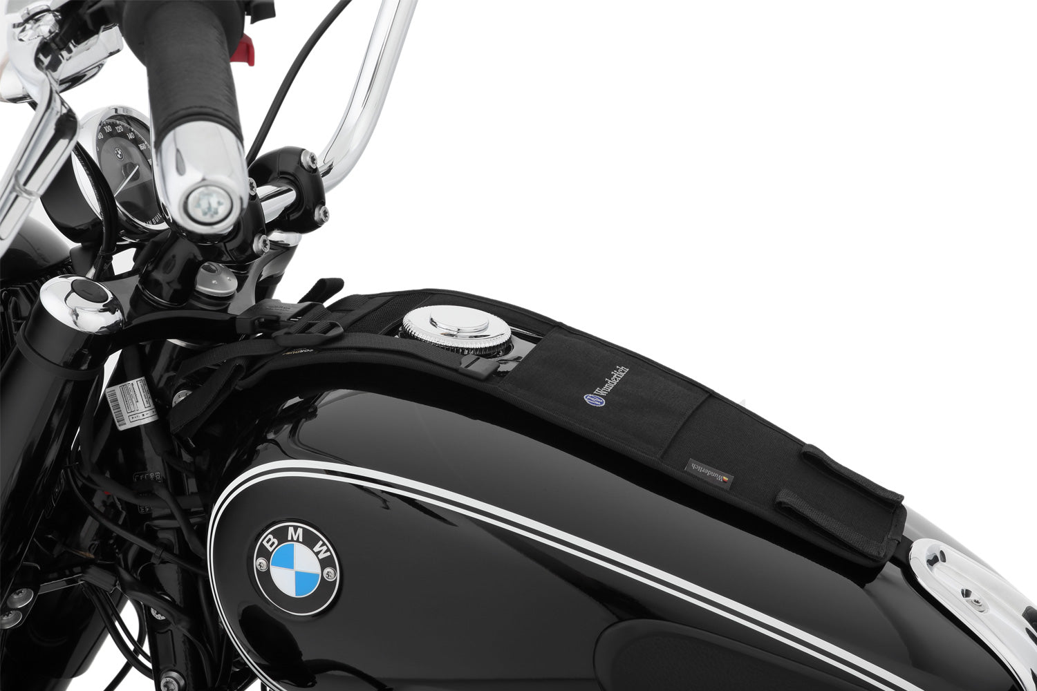 The mounting system is attached to the vehicle with minimal hand pressure and the tank bag can be quickly fastened to it.