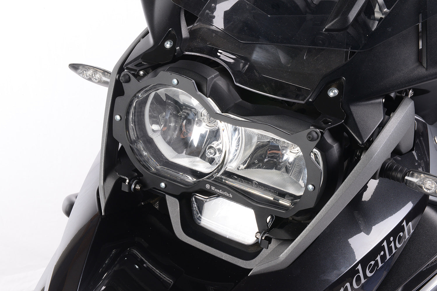 Foldable head light grille from Wunderlich provides effective protection for your bmw R1200GS LC Adv. headlight protection.