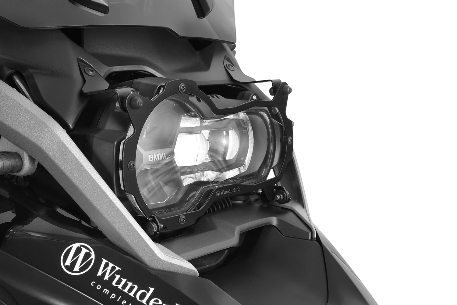 Foldable head light grille from Wunderlich provides effective protection for your bmw R 1200/1250 GS LC Adv. headlight protection.