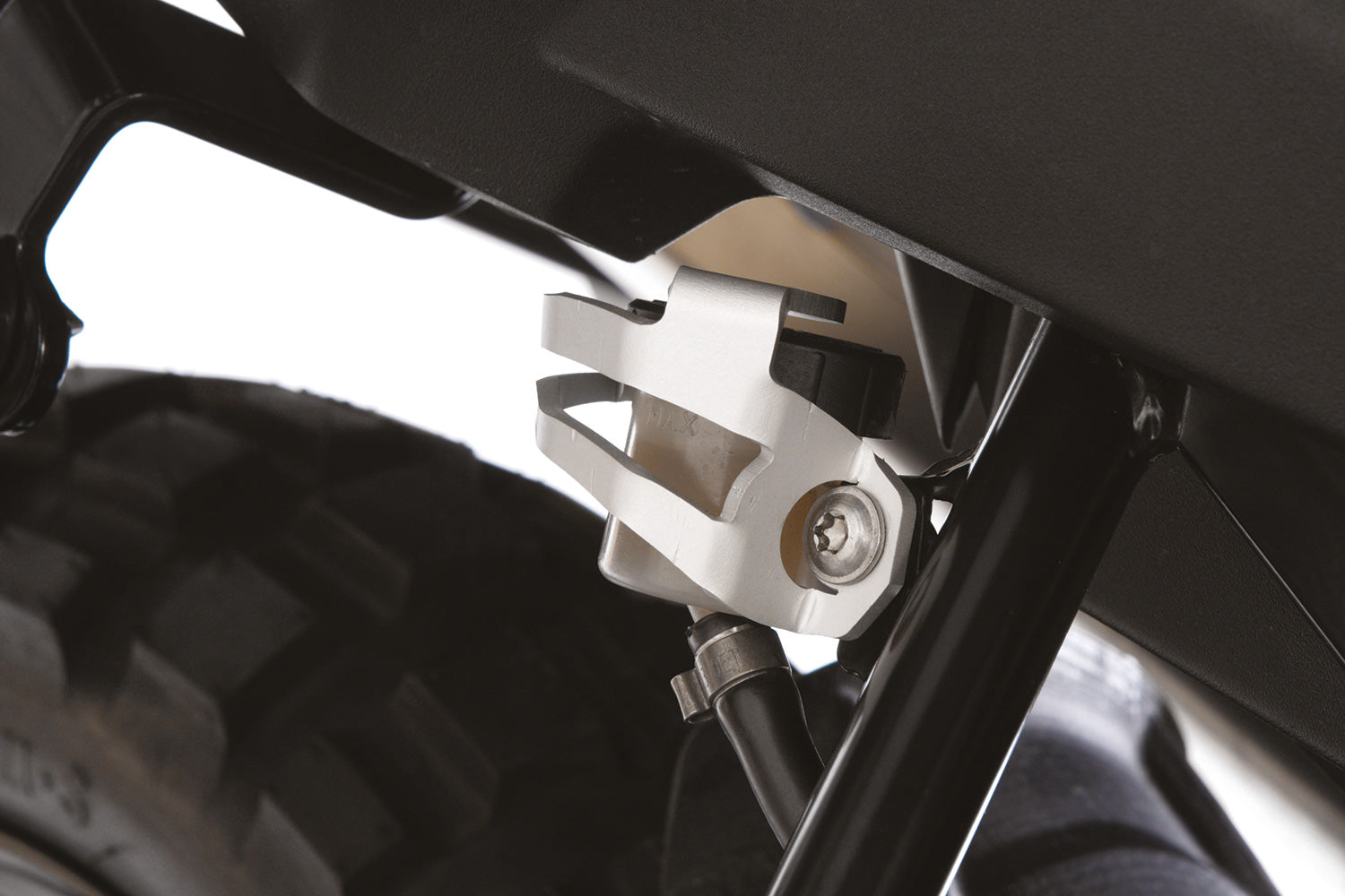 Protects the rear brake reservoir, which is otherwise vulnerable to deliberate damage and to being ripped off altogether.