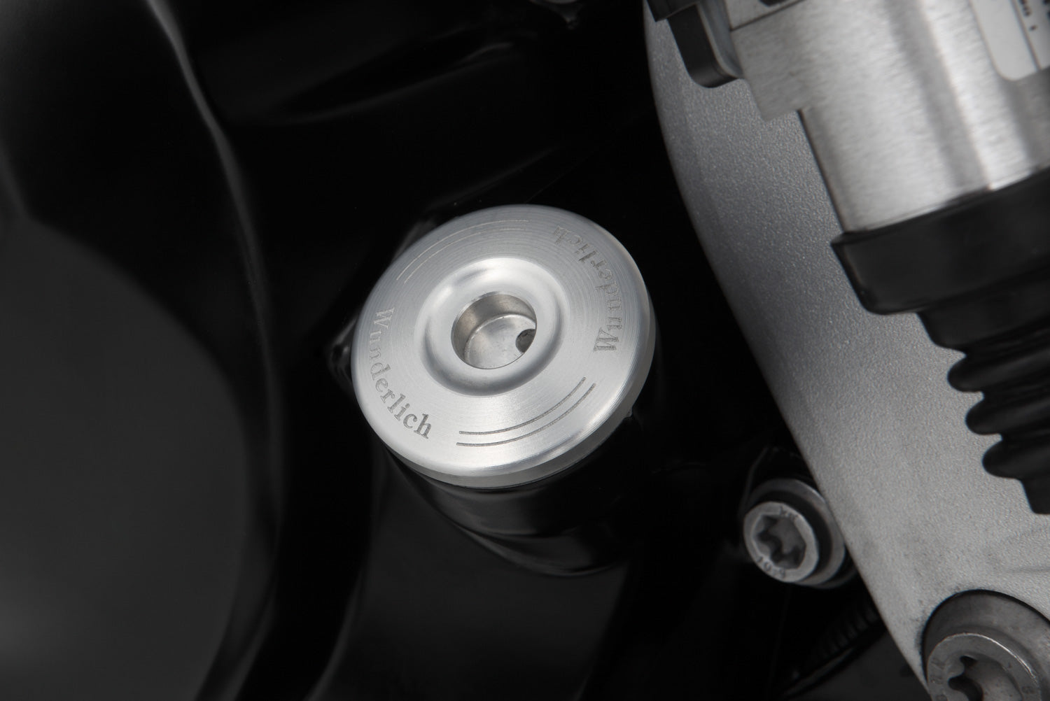Lockable oil plug with discreet, single-piece design, with zero mechanism