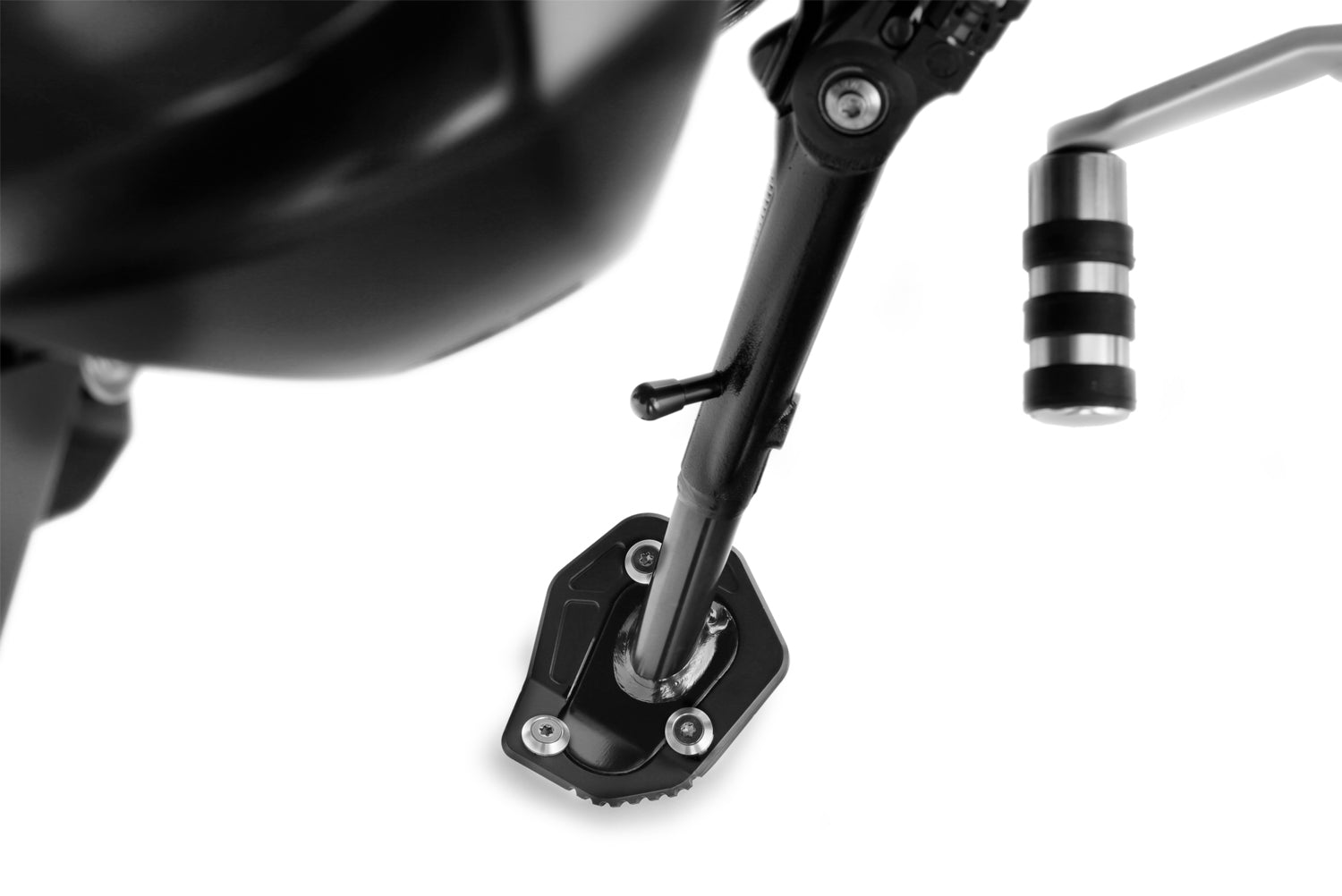 A precisely machined extension plate that can quickly be bolted to the side stand eliminates this risk.