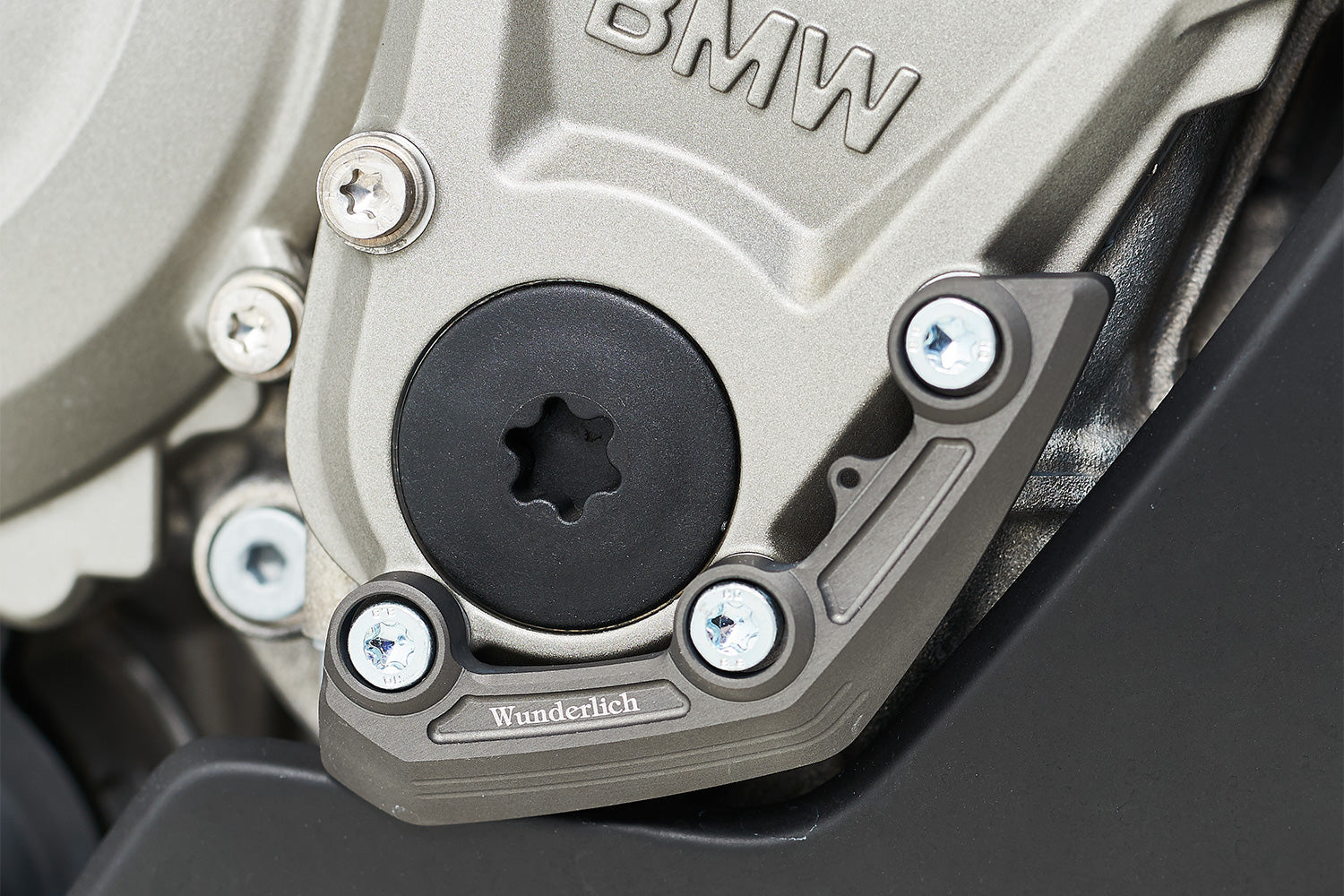 Shock-absorbing grey anodised ignition rotor cover for S 1000 R/ RR that protects the exposed engine covers.