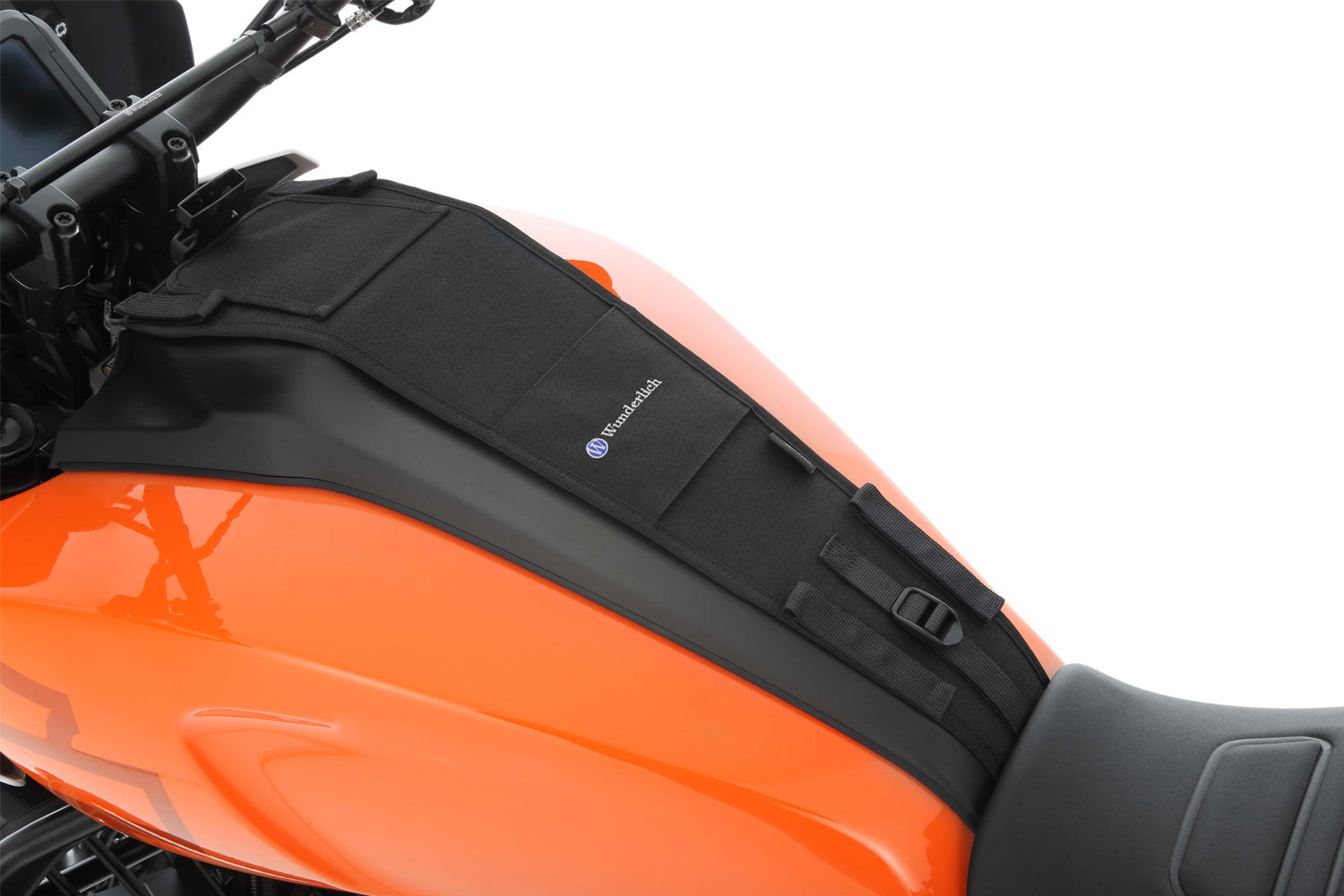 The mounting system is attached to the vehicle with minimal hand pressure and the tank bag can be quickly fastened to it.