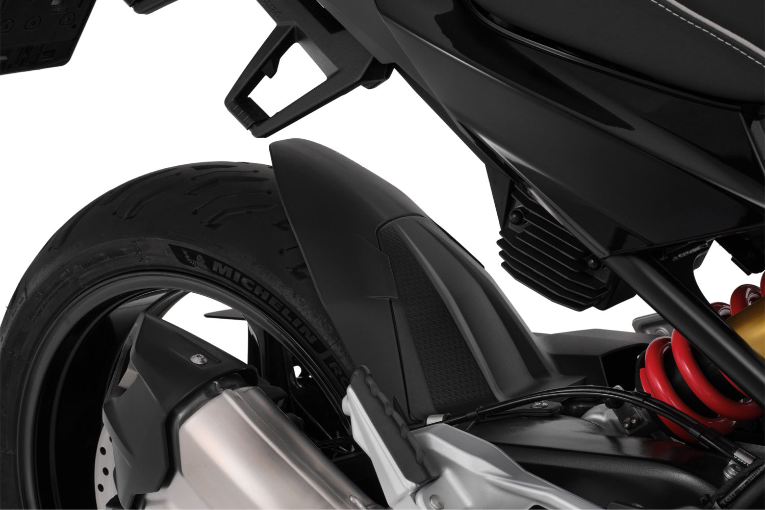 The area around the swing arm pivot, the swing arm, the collector, the gears and the shock absorber are in front of the rear wheel and thus