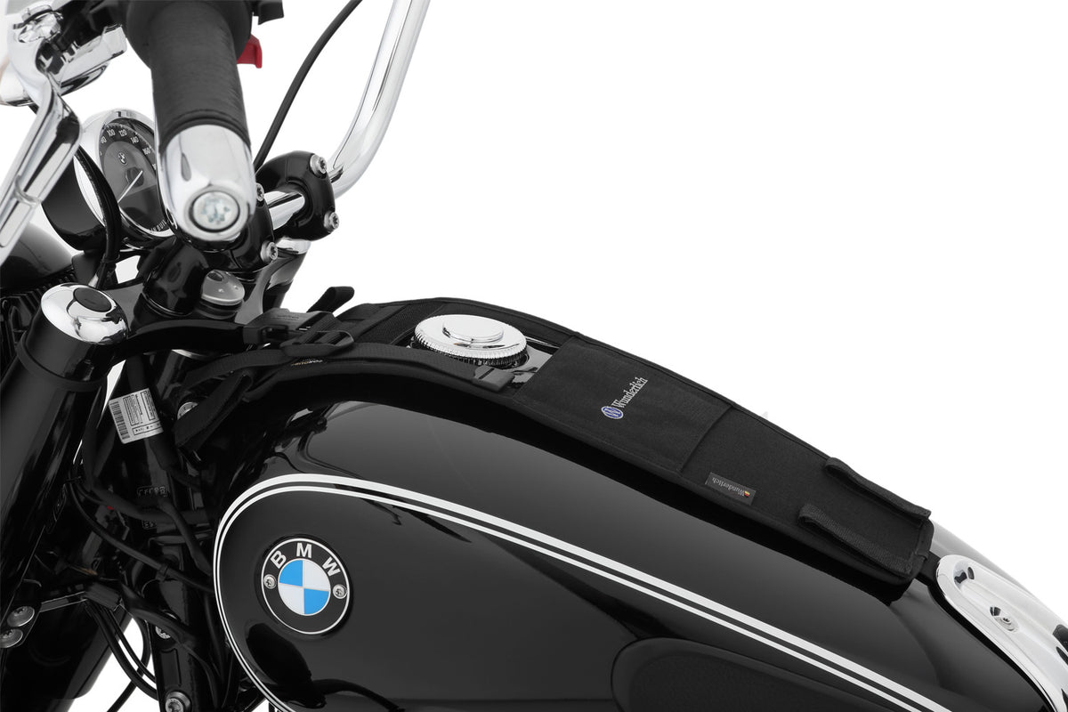 The mounting system is attached to the vehicle with minimal hand pressure and the tank bag can be quickly fastened to it.