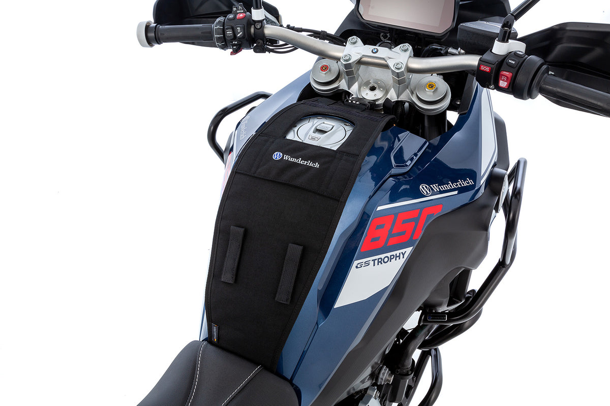 The mounting system is attached to the vehicle with minimal hand pressure and the tank bag can be quickly fastened to it.