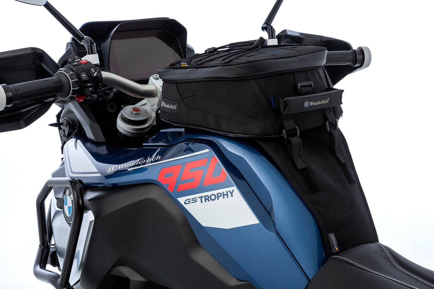 The mounting system is attached to the vehicle with minimal hand pressure and the tank bag can be quickly fastened to it. 