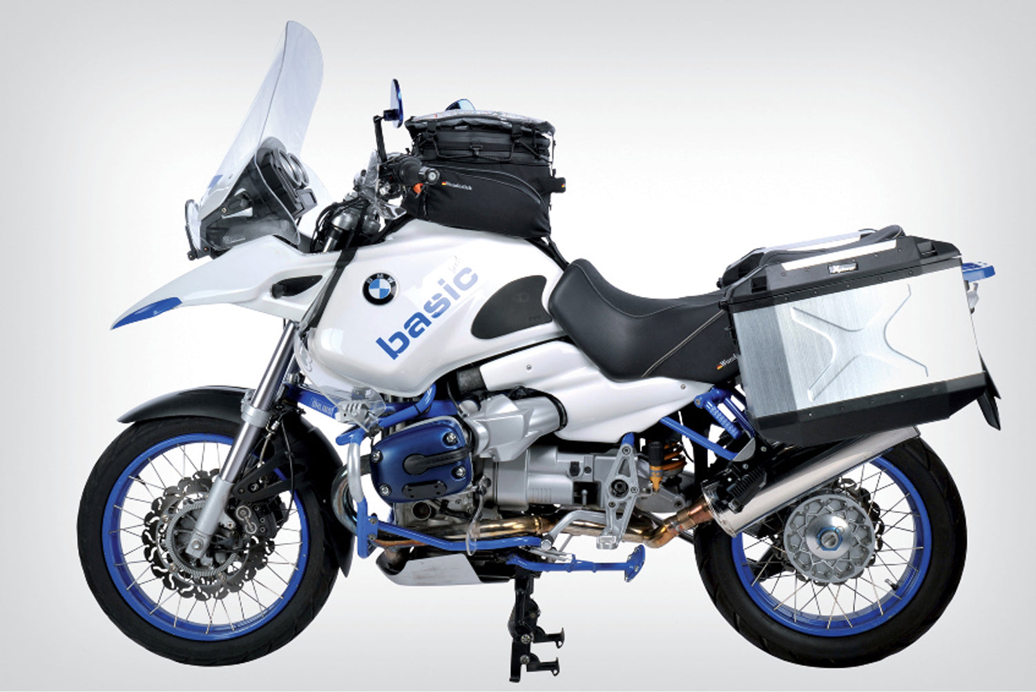 The mounting system is attached to the vehicle with minimal hand pressure and the tank bag can be quickly fastened to it. 