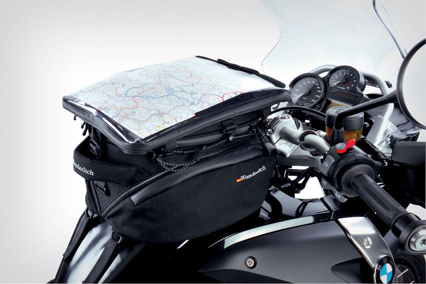 The mounting system is attached to the vehicle with minimal hand pressure and the tank bag can be quickly fastened to it. 