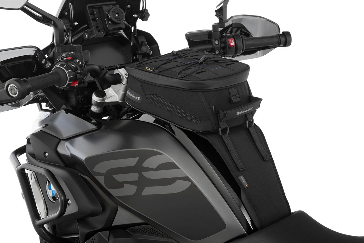 The mounting system is attached to the vehicle with minimal hand pressure and the tank bag can be quickly fastened to it.
