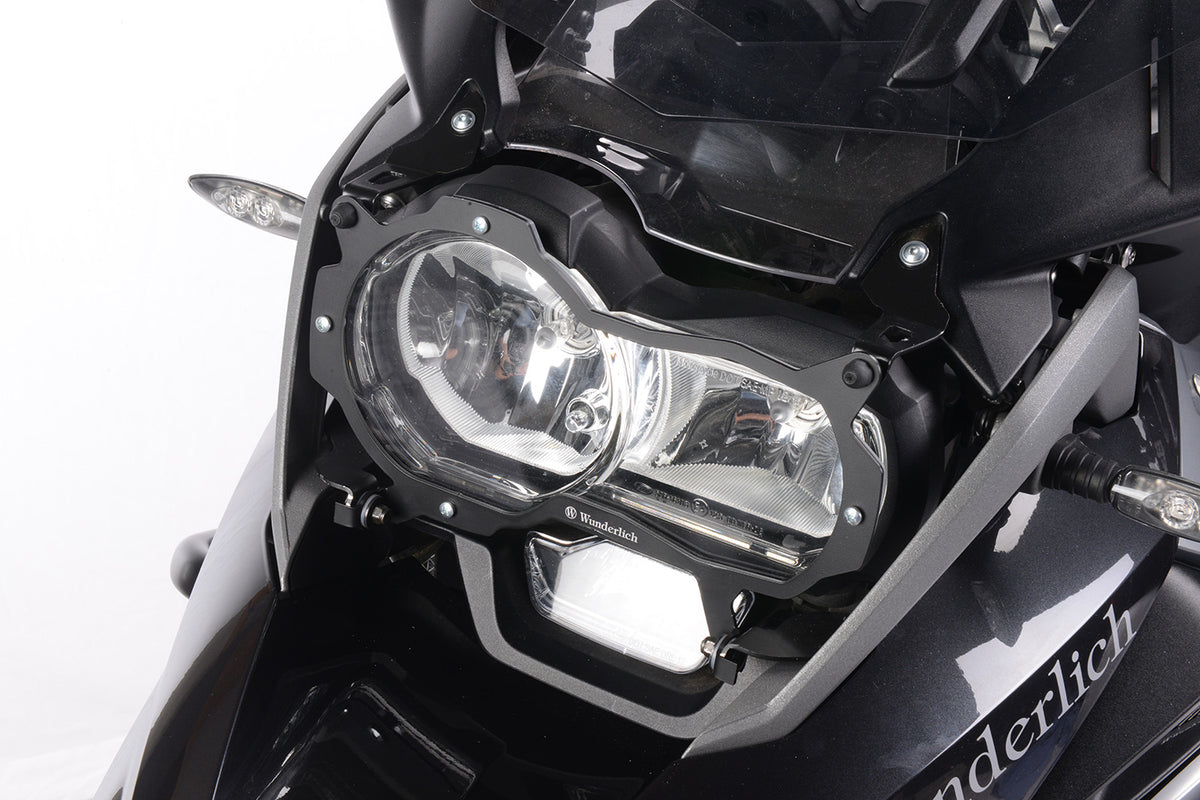 Foldable head light grille from Wunderlich provides effective protection for your bmw R1200GS LC Adv. headlight protection.