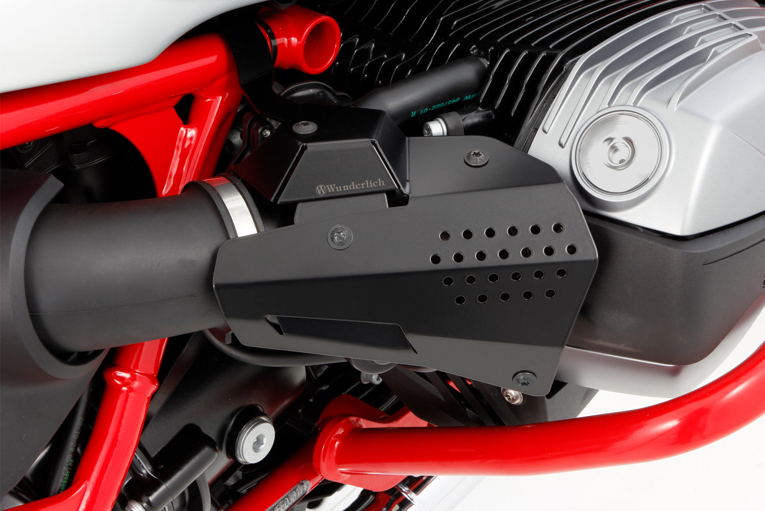 The cover of the fuel injection system protects the intake pipe area including the injector tube, line connections and throttle valve sensor