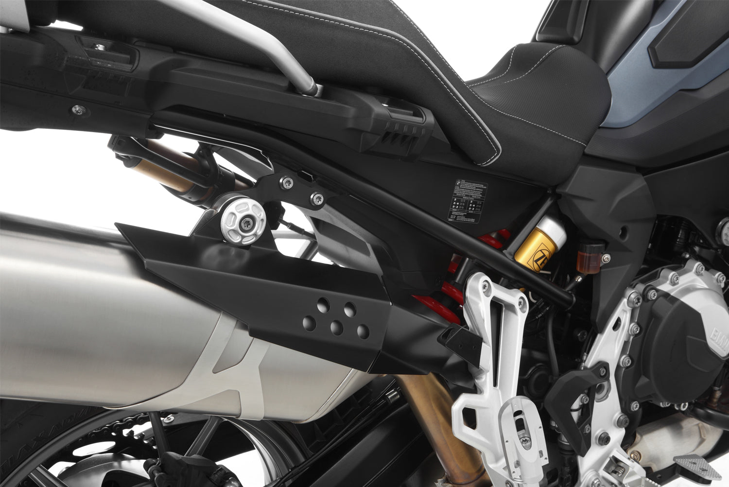 Covers the front of the rear silencer and thereby protects exposed areas against painful contact and burns.