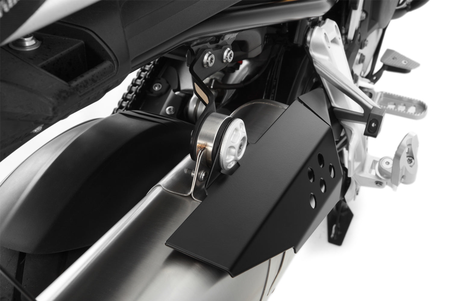 Covers the front of the rear silencer and thereby protects exposed areas against painful contact and burns.