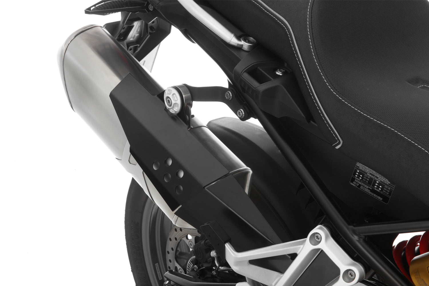 Covers the front of the rear silencer and thereby protects exposed areas against painful contact and burns.