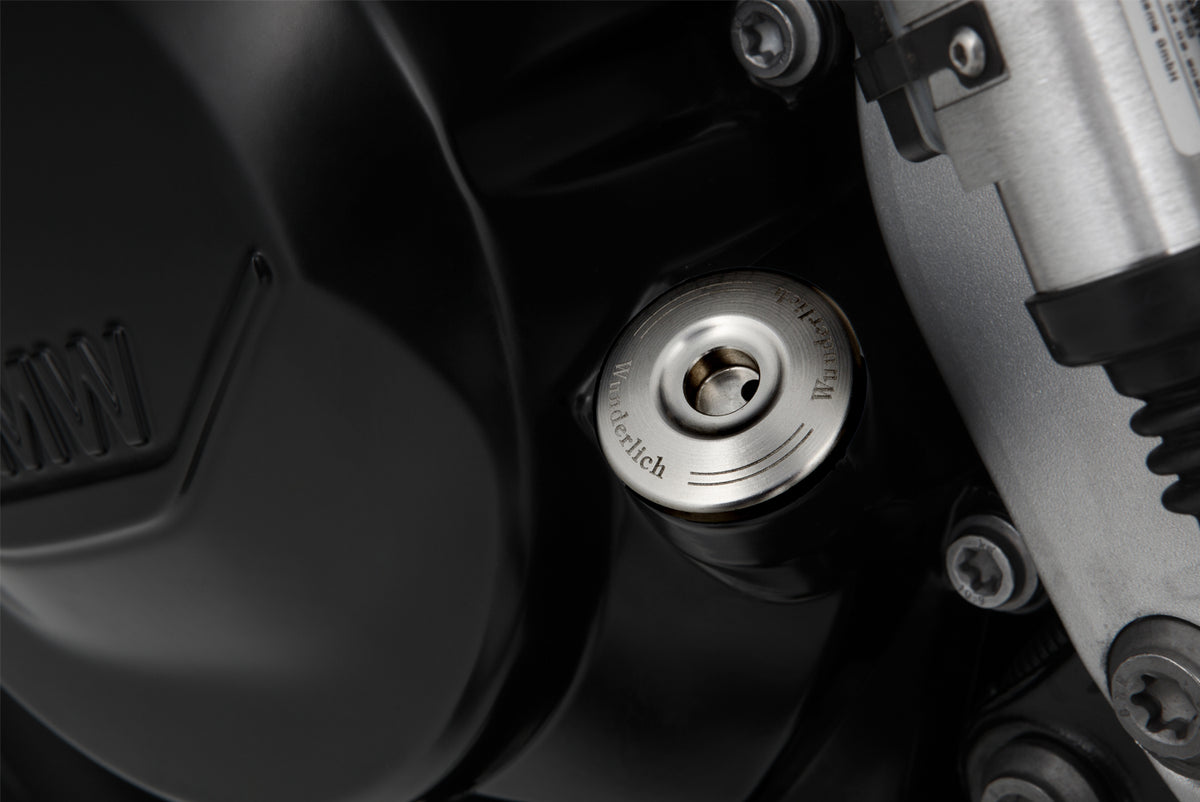 Lockable oil plug with discreet, single-piece design, with zero mechanism