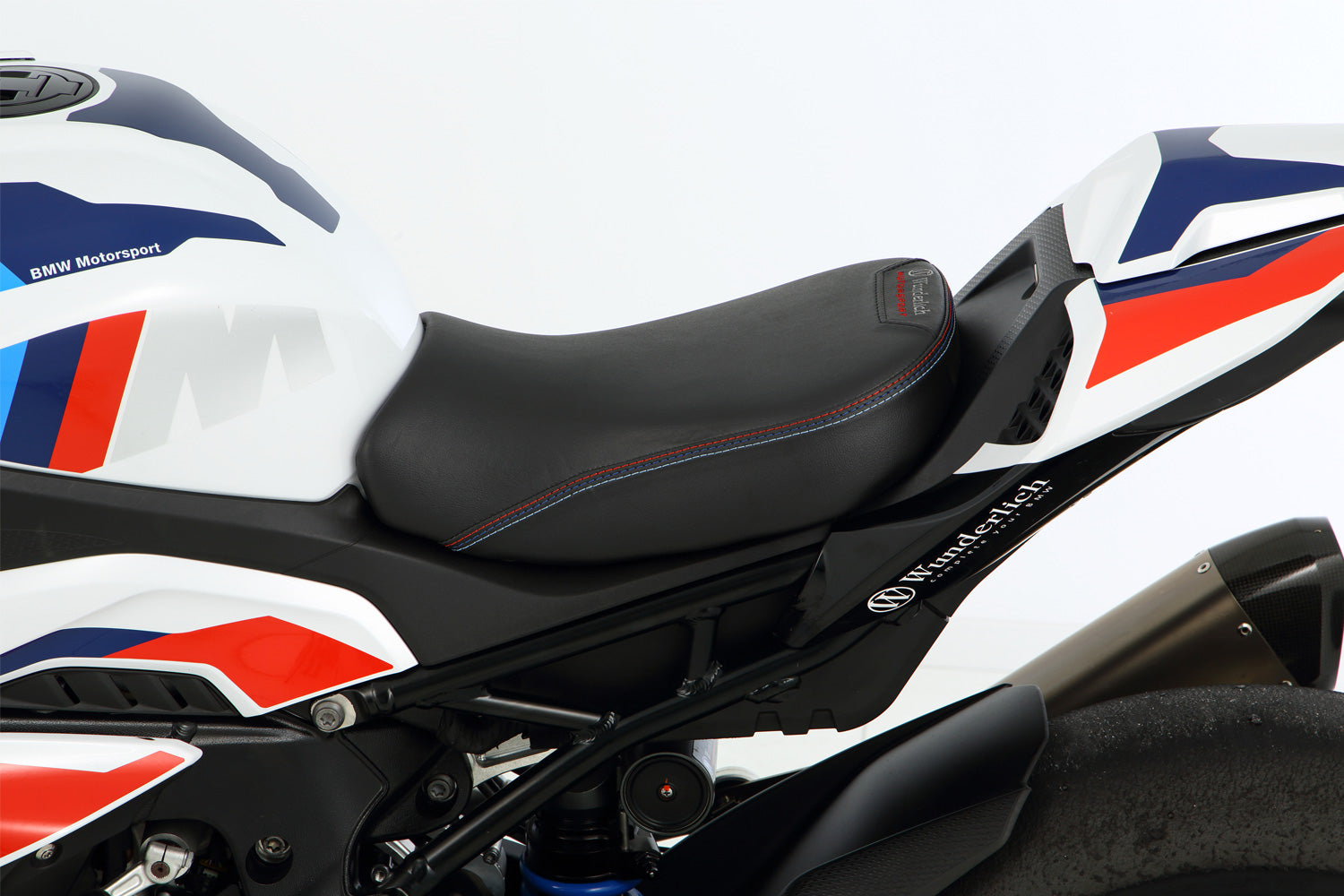 A racing seat trimmed for performance - 40 mm higher than the standard seat height