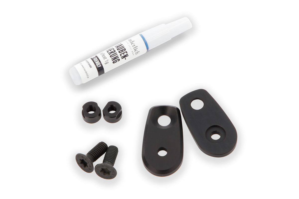 This adapter covers the opening on the original indicator bracket and simultaneously lets you attach accessory indicators.