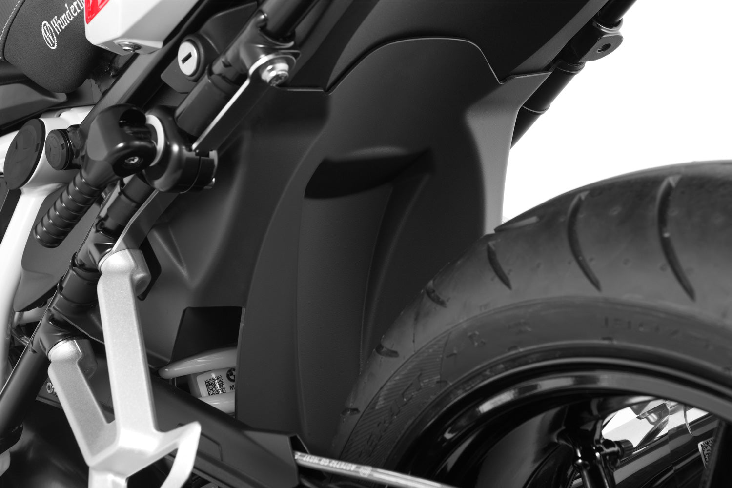 This splash guard protects the shock, along with shock mounts, swing arm, collector pipes and rear of the gearbox of the R 1200 RS LC.