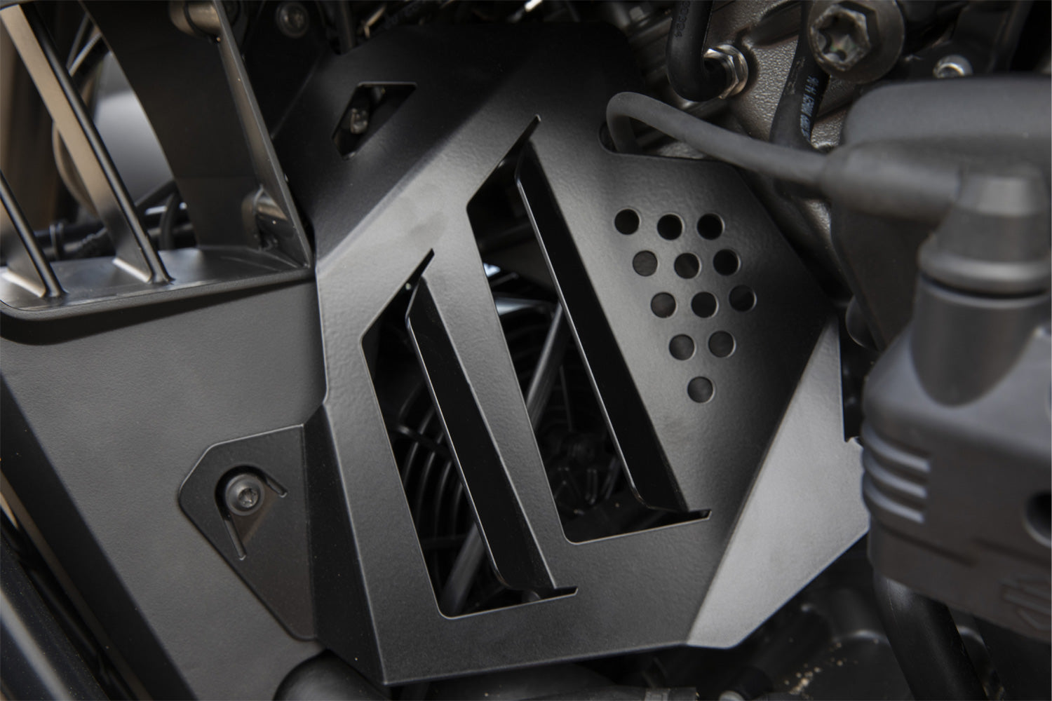 Enhances the bike's visually and directs the hot air dissipated by the fan to the outside through its attached openings.