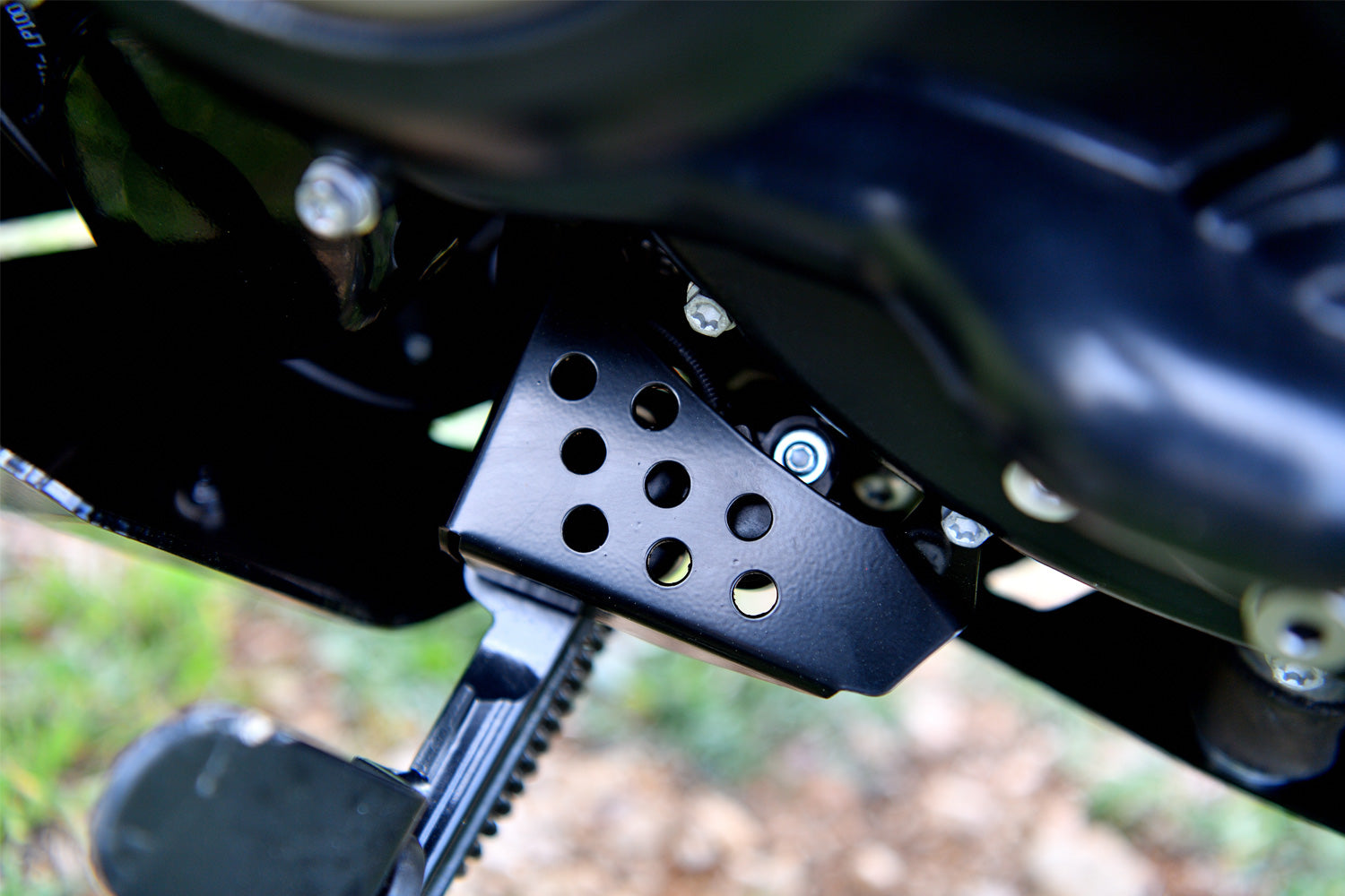 Solid all-round protection for the exposed ignition interruption switch on the side stand.