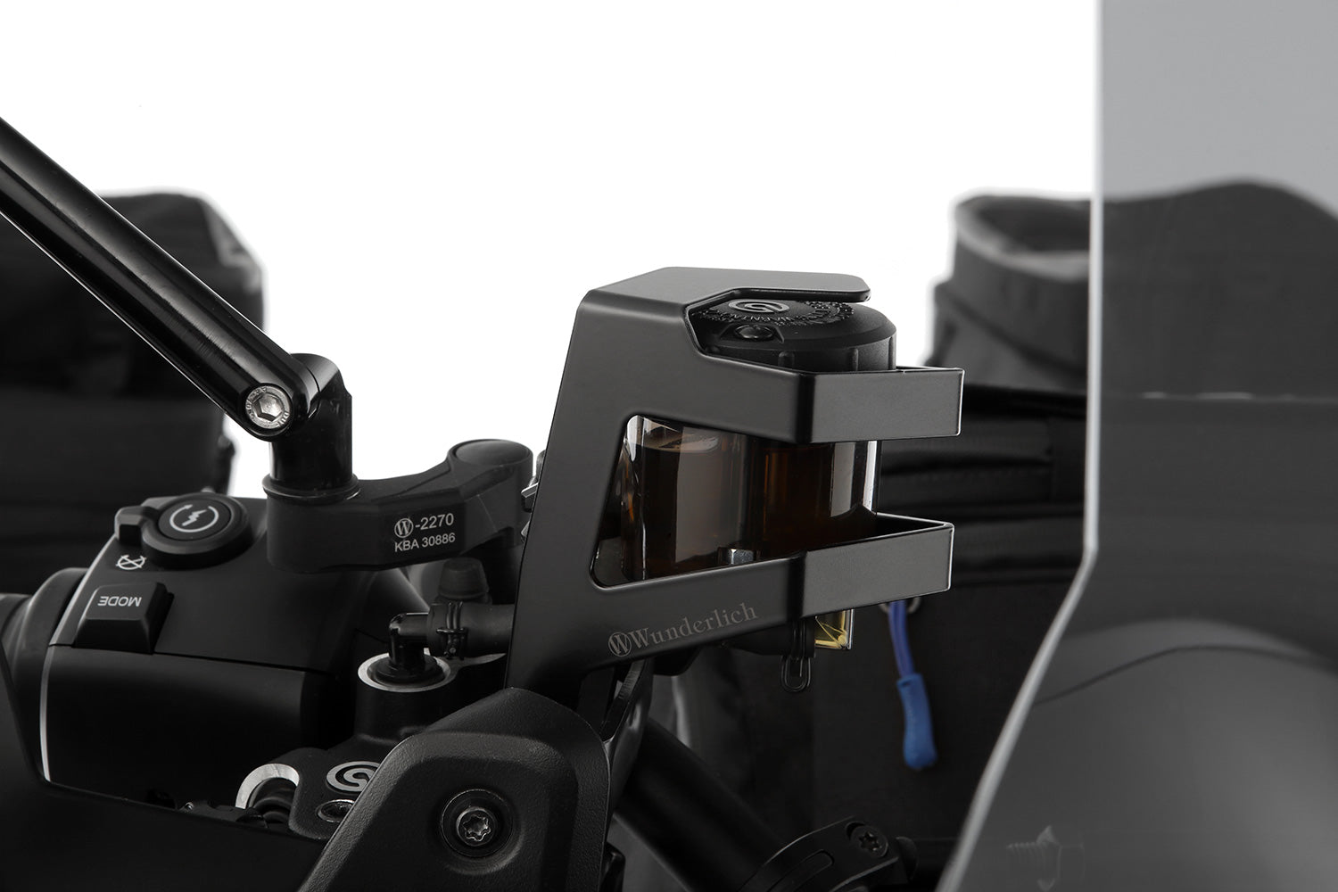 Discreetly integrated protective cover for the front brake fluid reservoir