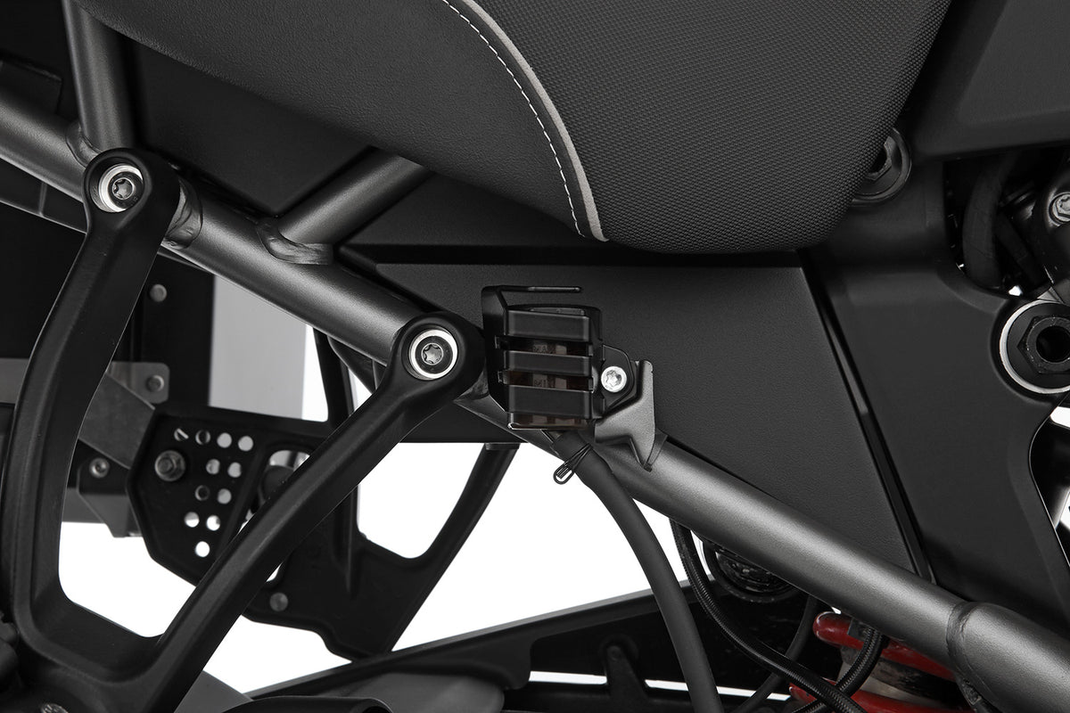 Discreetly integrated protective cover for the rear wheel brake fluid reservoir
