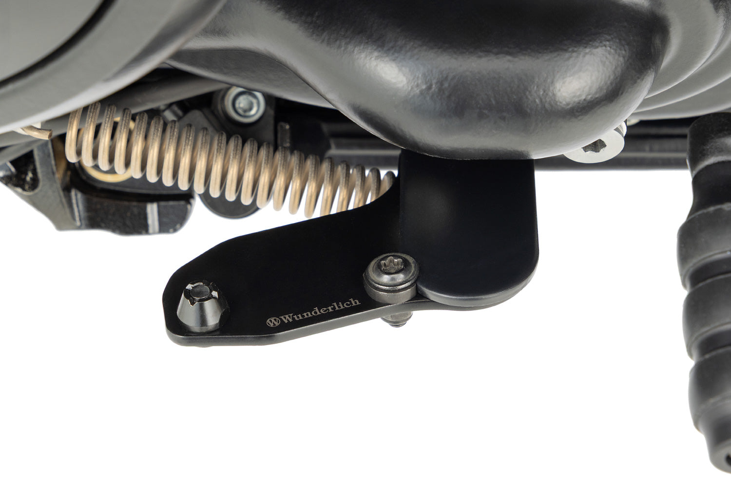 Enlarges the operating area of the side stand and makes it much easier and more ergonomic to fold out.