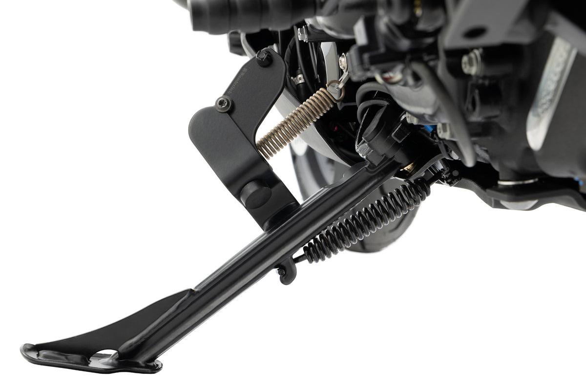 Enlarges the operating area of the side stand and makes it much easier and more ergonomic to fold out.